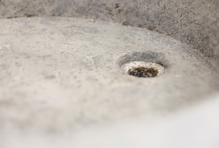 reclaimed sink of burgundy stone