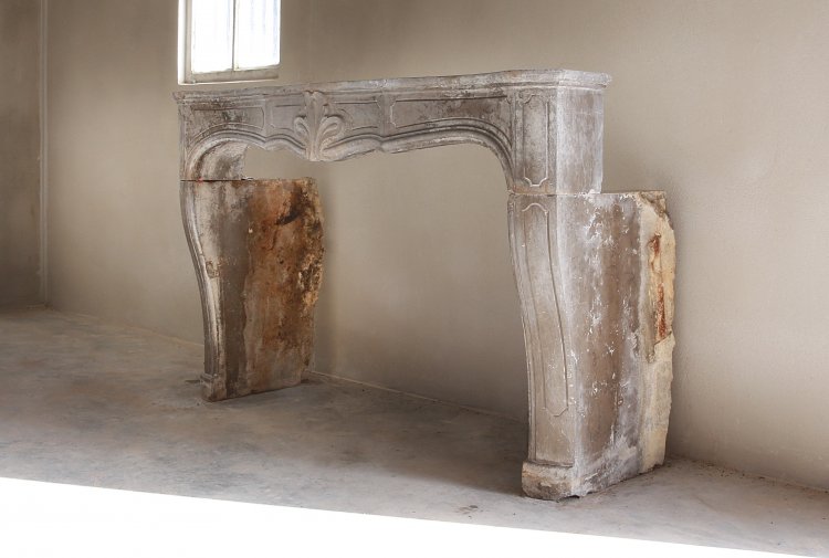 antique fireplace of limestone