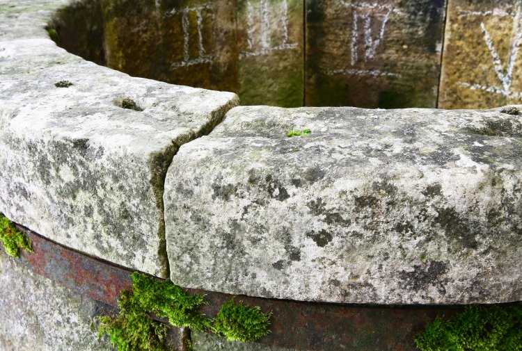 antique limestone well head