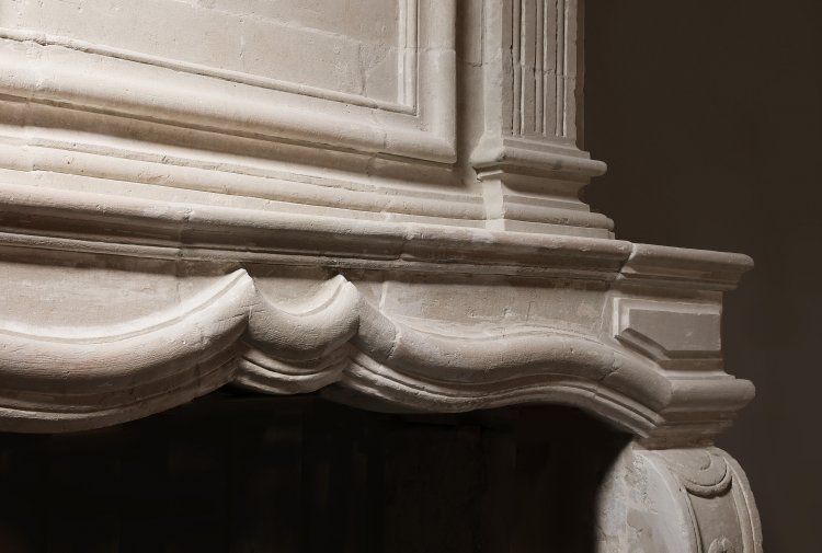 old mantle surround of french limestone