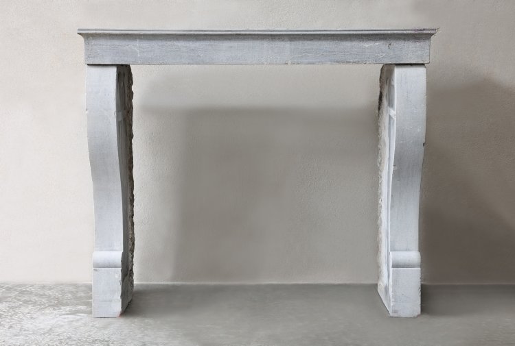 antique fireplace of marble stone